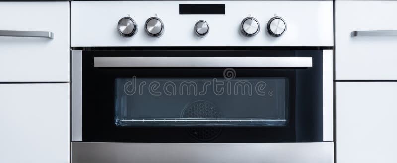 The modern built-in oven with sleek stainless steel design in a contemporary kitchen.. image royalty free stock photos.