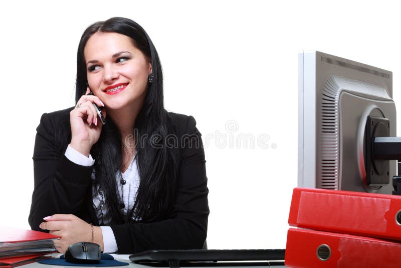 Modern business woman talking phone sitting at office desk