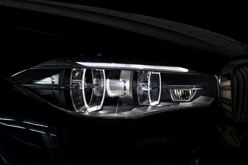 Modern car headlight with backlight.