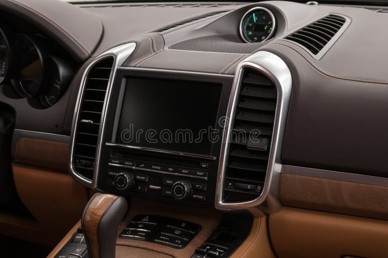 Modern car interior design. Multimedia screen and control buttons.