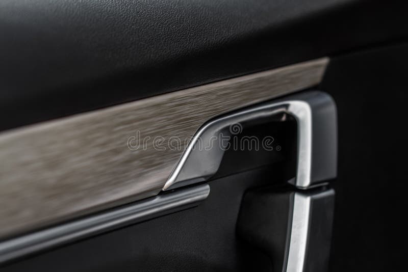 Modern Car Interior Door Handle Close Up.Modern Car Interior Door