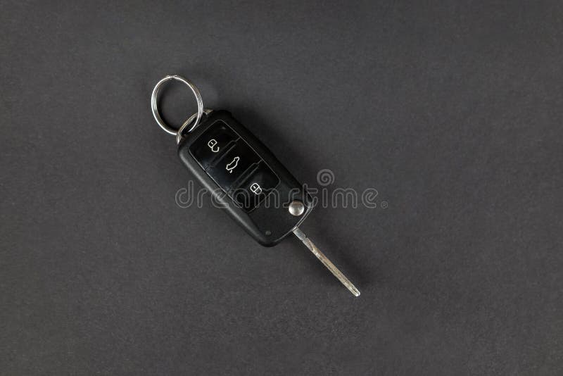 Modern Car Keys Isolated on Black Background with Copy Space for Text. Folding Key with Remote