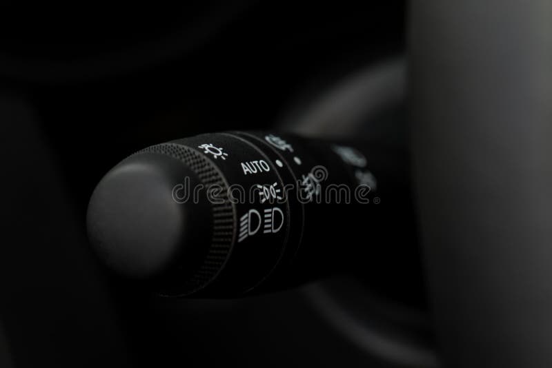 Modern Car Light Switch. Turning on Headlight in the Car Stock Photo