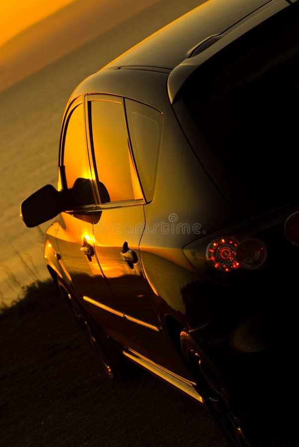 Modern Car Watching Sunset