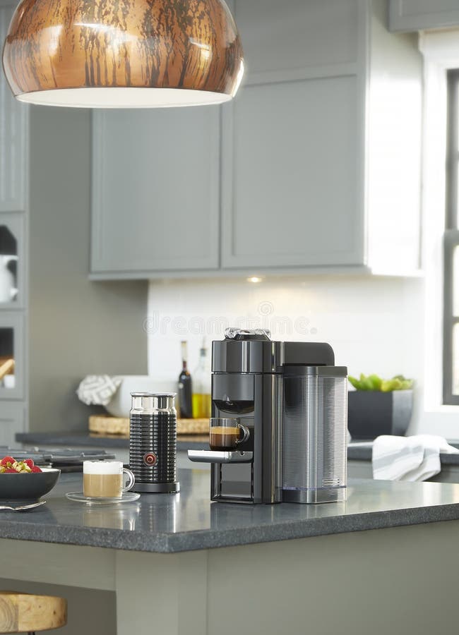Modern Coffee Machine with Glass Cup on Kitchen Table Stock Image