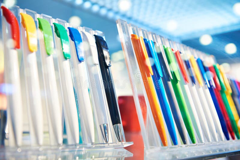Colored plastic pens on store display royalty free stock photo
