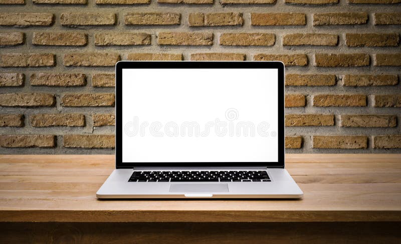Modern computer,laptop with blank screen on wall brick royalty free stock photos