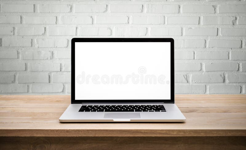 Modern computer,laptop with blank screen on wall brick royalty free stock photo