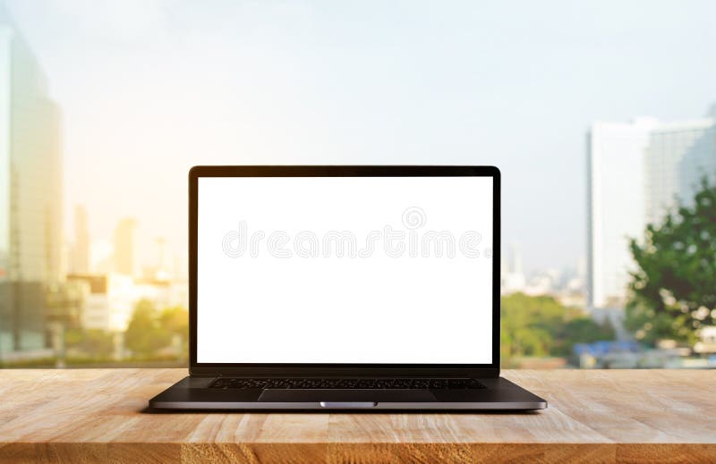 Modern computer,laptop with blank screen on wood table with office window view background