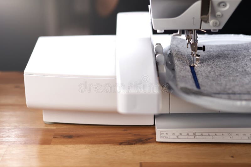 Embroidery of a Light Pink Magnolia on Classic Blue Boiled Wool and Needle,  Foot and Needle Bar of a Embroidery Machine Stock Image - Image of blanked,  luxury: 169112903