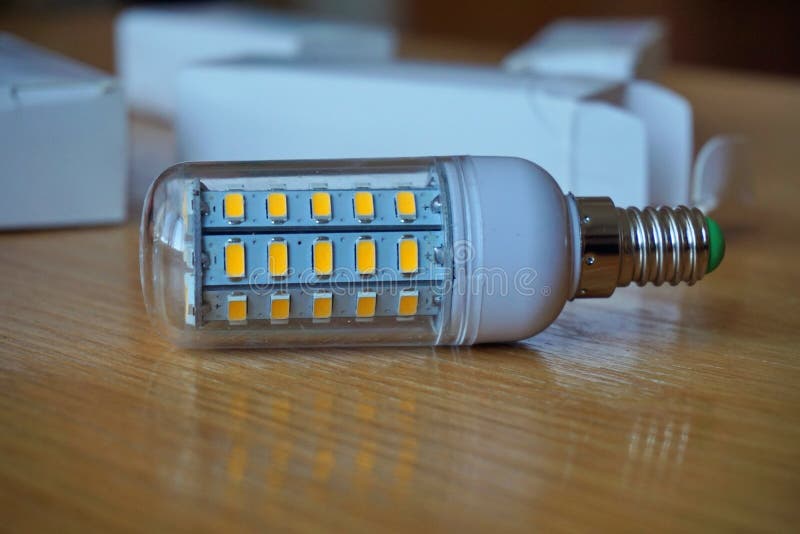 Modern cost-saving ecological LED (Light Emitting Diode) bulb in blue color stock photography Modern cost-saving ecological LED (Light Emitting Diode) bulb in blue color stock photography
