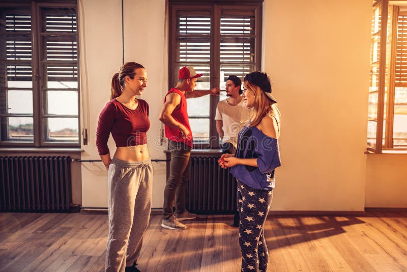 Young modern dancing girls in urban fitness center