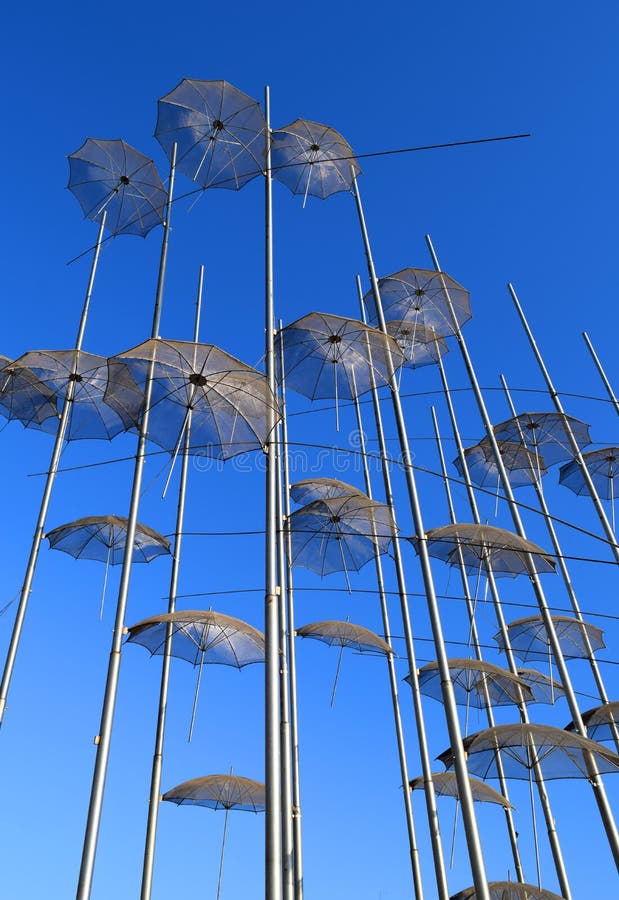 Zogolopoulos famous umbrellas in Thessaloniki seafront, Greece. Blue sky background stock images Zogolopoulos famous umbrellas in Thessaloniki seafront, Greece. Blue sky background stock images