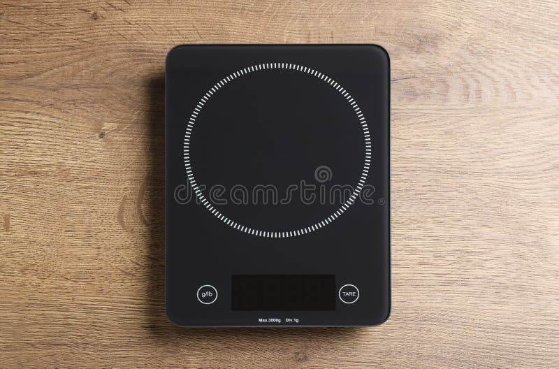 Modern Digital Kitchen Scale on Wooden Table, Top View Stock Image