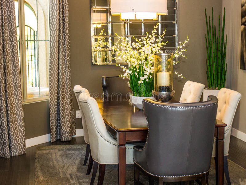 Modern Dining Room Table & Chairs with Large Centerpieces Stock Image
