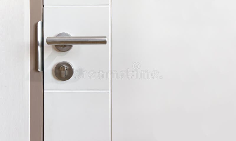 A modern door handle on wooden objects background foto de stock royalty free