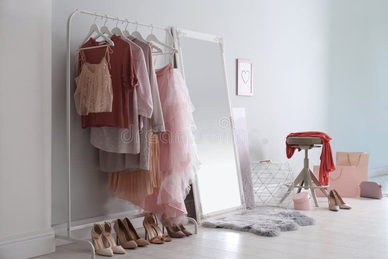 Modern Dressing Room Interior with Clothing Rack and Mirror Stock Photo