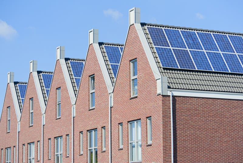 Modern Dutch houses with solar panels on roof