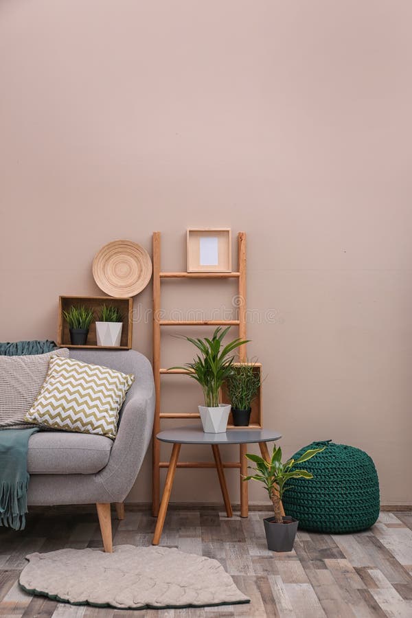 Modern eco style interior of living room with wooden crates and sofa