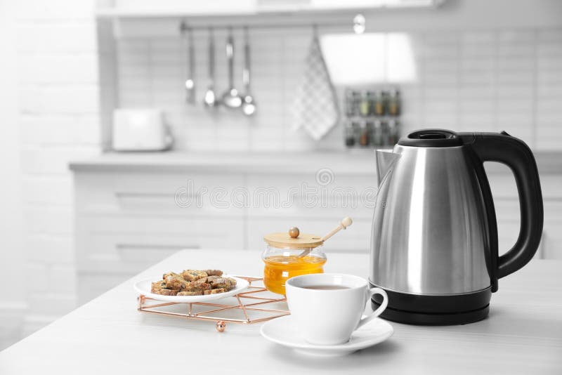 Modern Electric Kettle with Base and Plug Isolated on White Stock Photo -  Image of boil, household: 249433640