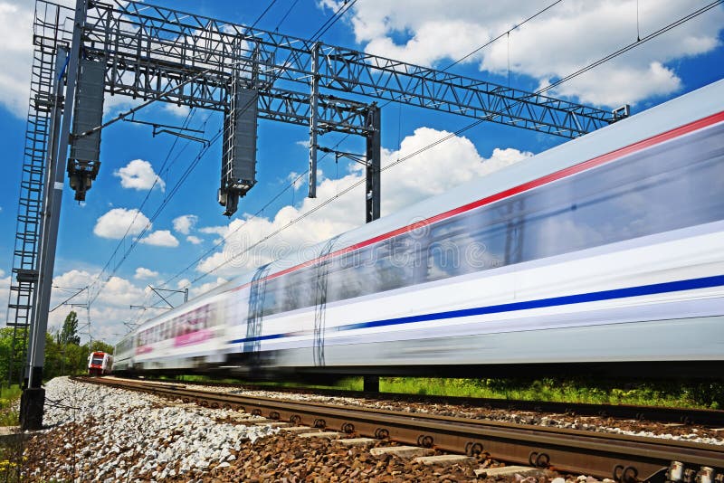 Modern Electric Passenger Train Moving on Full Speed Stock Photo