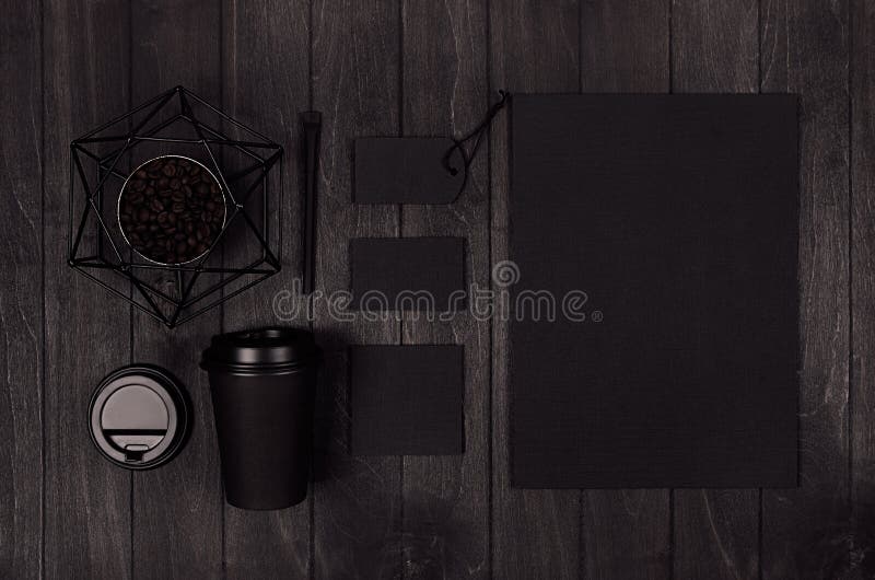 Modern elegance workplace or concept design for restaurant and coffee shop advertising - black paper cup, cap, blank paper. royalty free stock photo Modern elegance workplace or concept design for restaurant and coffee shop advertising - black paper cup, cap, blank paper. royalty free stock photo