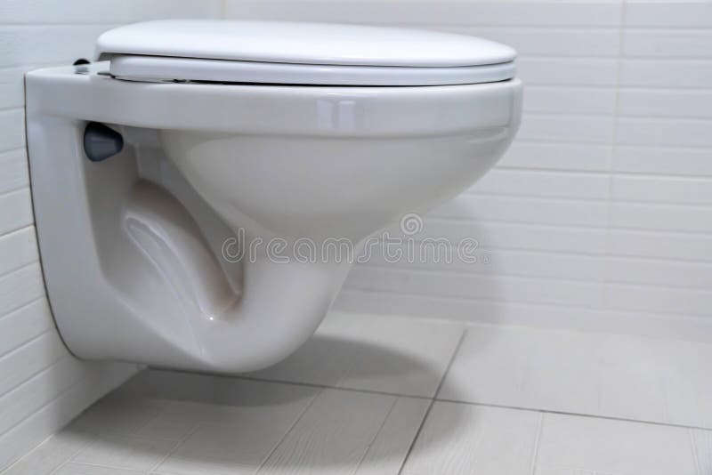 Modern flush toilet bowl at WC or water closet. Cistern button stock images, royalty-free photos and pictures