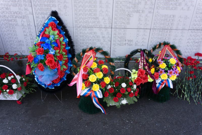 Modern funeral wreath made of red gerberas, lillies, anthurium in flower market Round shaped funeral wreath in red color - royalty free stock photos Modern funeral wreath made of red gerberas, lillies, anthurium in flower market Round shaped funeral wreath in red color - royalty free stock photos