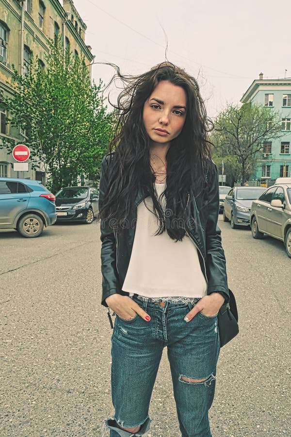 Beautiful woman wearing jeans standing in the street Stock Photo