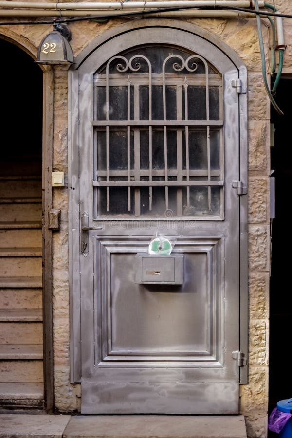 Modern grey metal door openwork with peaks a beautiful vintage background