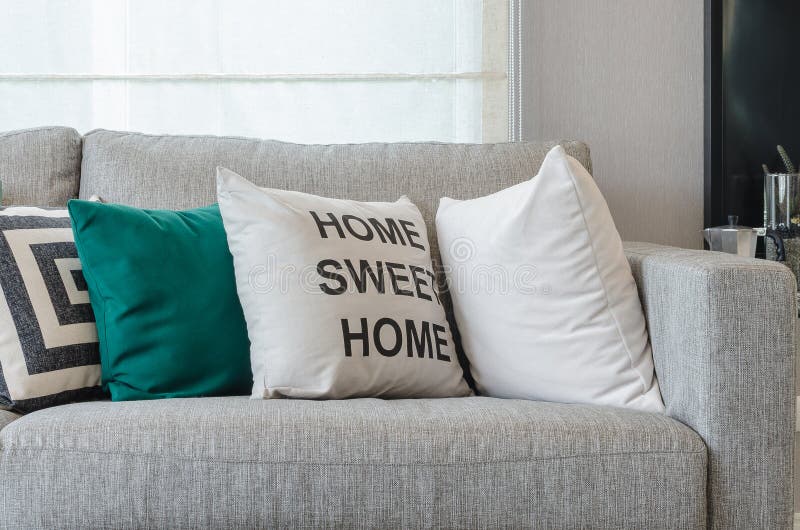 Modern Grey Sofa with Black and White and Green Pillows Stock Image