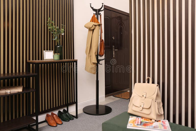 Modern Hallway Interior with Console Table and Clothes Rack Stock Photo