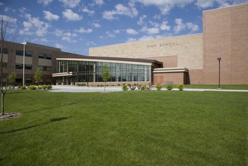 Modern high school with blue sky and clouds stock image