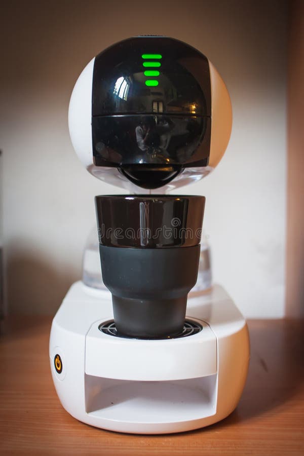 Modern high-tech coffee machine design. touchscreen. stylish cup of coffee. royalty free stock image