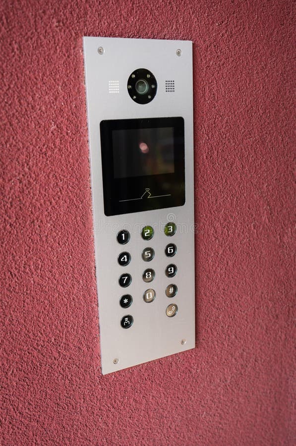 Modern intercom with video camera, apartment code on the panel of the electronic intercom. The concept of protection and security stock image