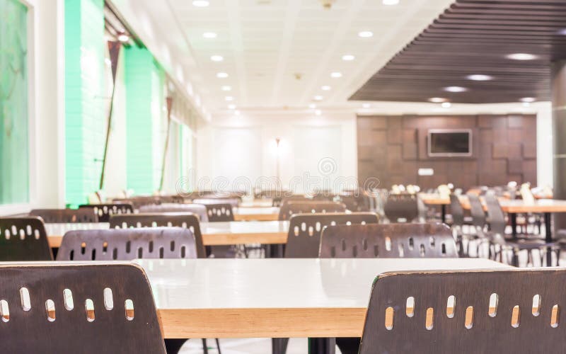 Modern Interior of Cafeteria or Canteen with Chairs and Tables Stock