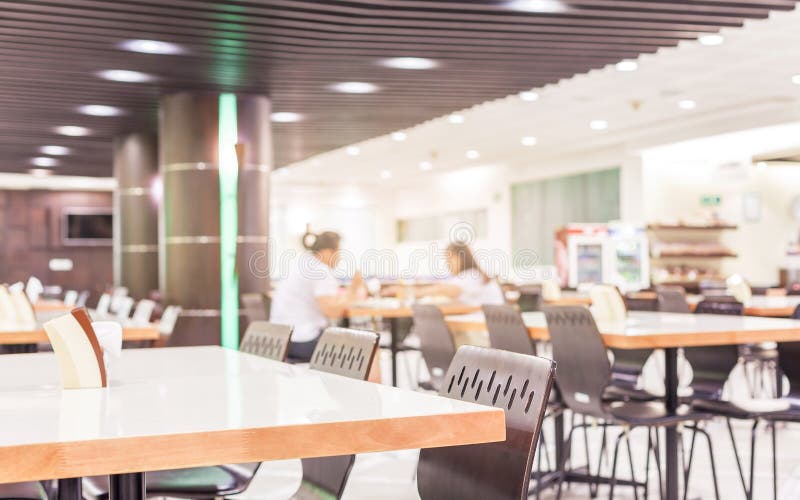Modern interior of cafeteria or canteen with chairs and tables stock photos