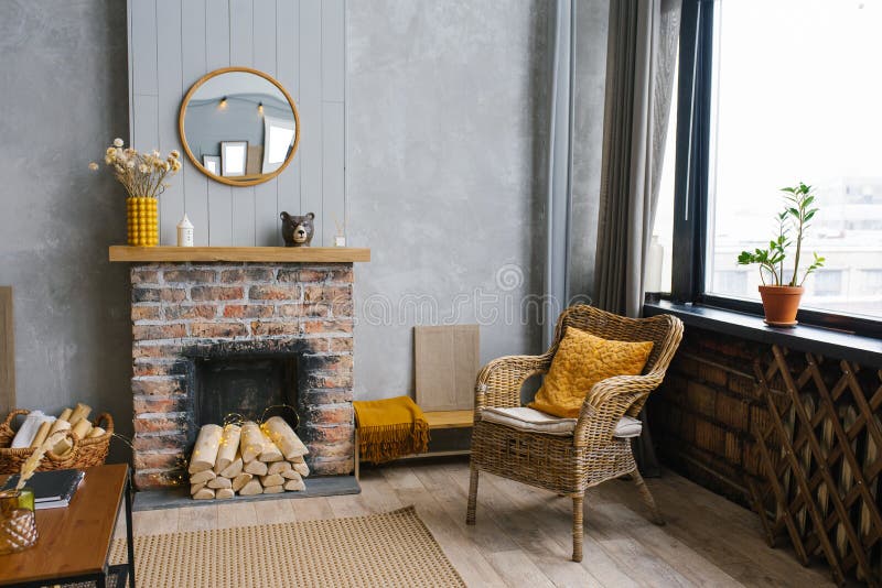 Modern interior with decorative fireplace and rattan chair, Scandinavian style. stock photo