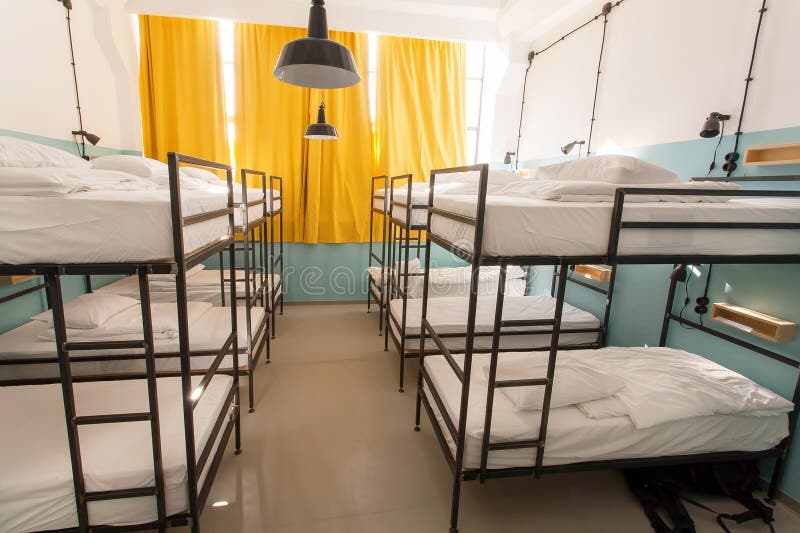 Modern Interior of Dormitory Room with Bunk Beds in New Hostel Style for Many Students Stock