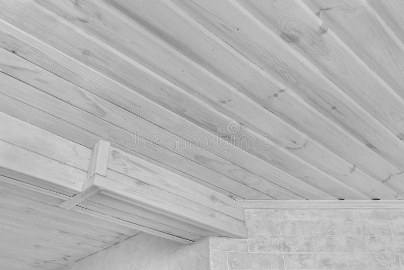 Modern Interior with Light Wood Ceiling and White Plaster and Brick