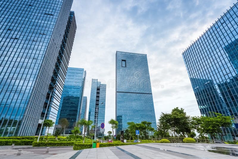 Modern international business operations center with glass architecture in cloudy