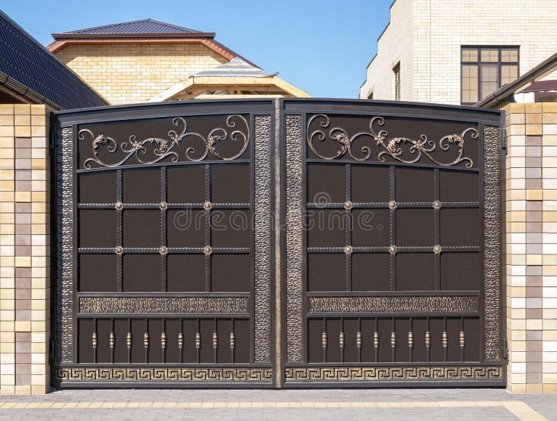 Modern iron gate and facade stock photography