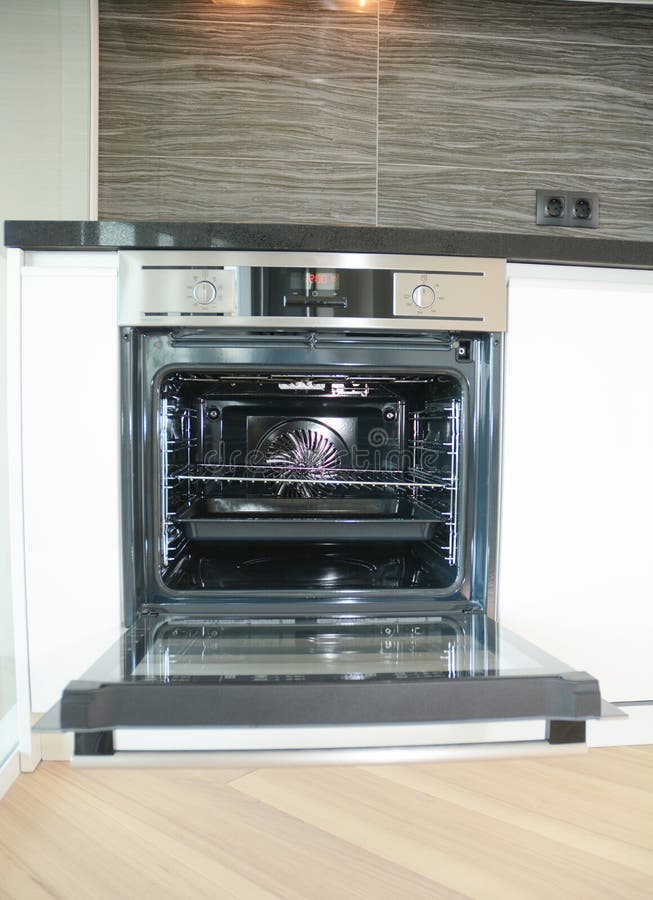 Modern Kitchen Interior with Electric Oven, Electic Stove in Light Blur
