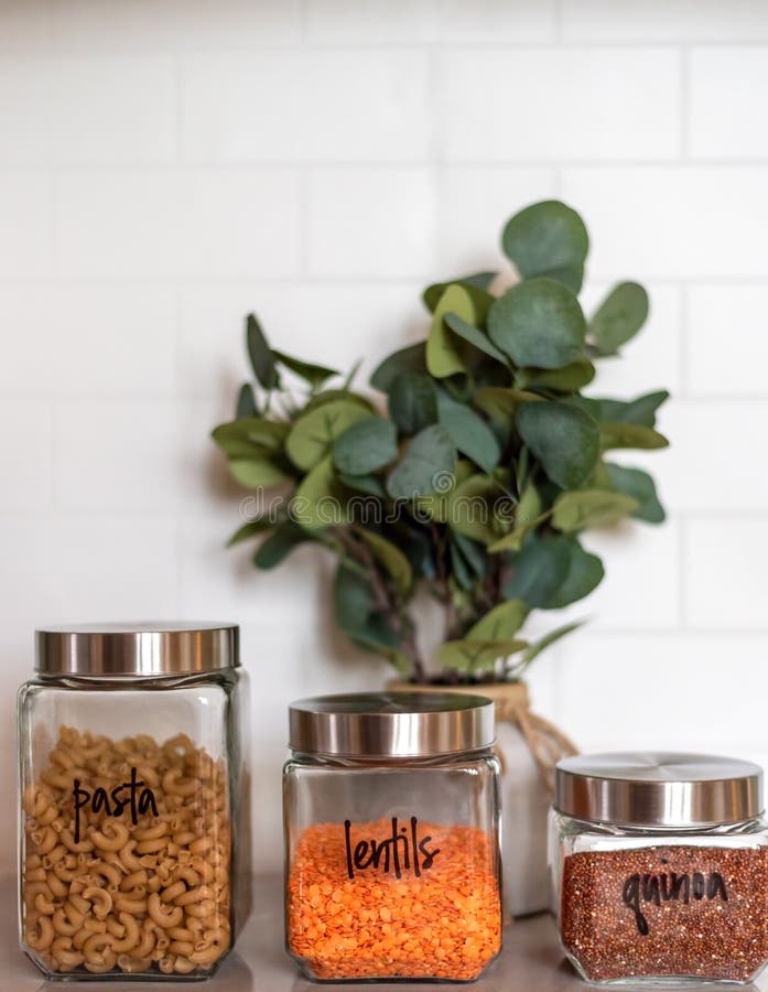 Organized kitchen pantry with labeled canisters