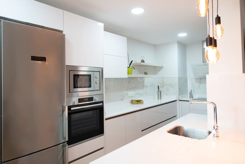 Modern Kitchen Perfectly Equipped with Its Appliances in a House Stock