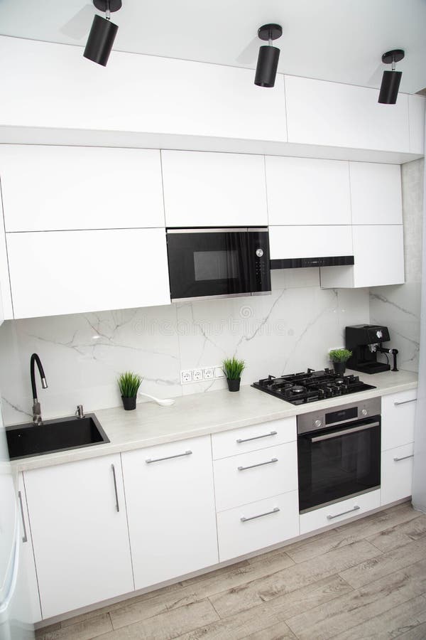 Modern Kitchen in White and Black. Beautiful New Interior Stock Image -  Image of cuisine, white: 247634691