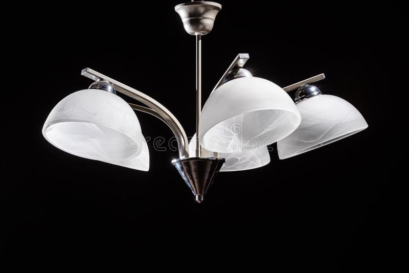 Modern Lamp, Chandelier on a Black Background. Lighting Element of the