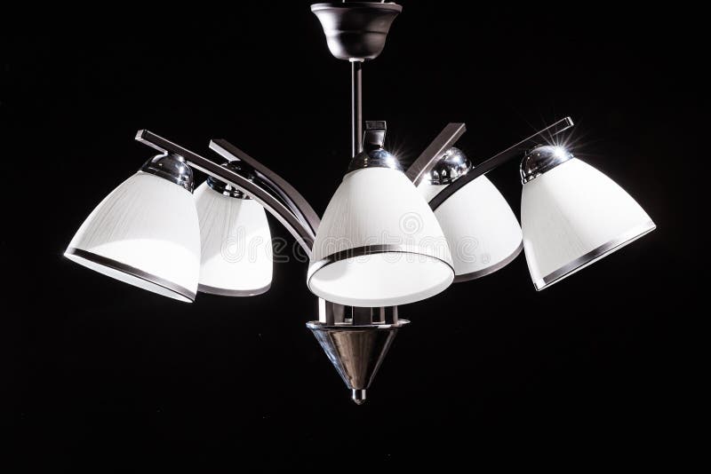 Modern Lamp, Chandelier on a Black Background. Lighting Element of the