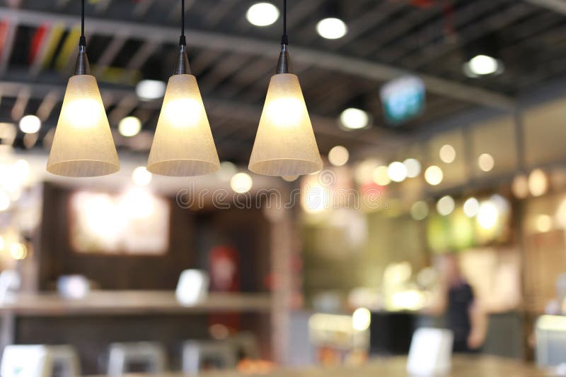 Modern Lamp Hanging from the Ceiling of the Restaurant Stock Photo
