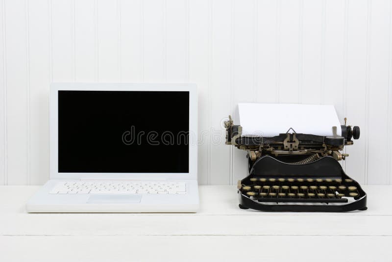 Modern Laptop and Antique Typewriter royalty free stock images